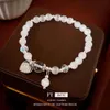 Bracciale di perline per perline del gatto dell'amore coreano dolce, alla moda, semplice ed elegante che stringe una nuova ragazza versatile