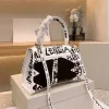 Designer väskor mode kvinnor crossbody axel tygväska handväska lyxgraffiti timglas handväska toppkvalitet läder shopping tote cyg24041003-25
