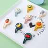 Ganci 1pcs cartone animato portiera da punzonatura senza tracce per chiodi piccoli vestiti per ganci a parete montata decorativa in plastica