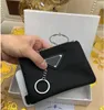 Designer -Schlüsselanlagen Dreieck Signatur schwarzer Nylon -Leinwand Beutel P Rada Schlüsselkette Mini -Brieftaschen Reißverschluss Taschenbaus Männer Marken Key Ring Card Halter Aufbewahrungsbeutel