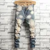 Jeans maschile angosciati strappati blu retrò pantaloni motociclisti sottili