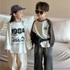 T-shirt 2024 Spring Boys and Girls Cartoon Letters Cotton T Shirts Kids Of Ock Sciose Long Sleeve Tops 240410
