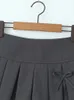 Chu Sau Beauty 2024 Kvinnor Spring Fashion Sweet Super Kort kjol Sexig låg midja Båge bundna minikjolar Chic Slim Pleated Skort 240328