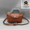 Los bolsos de la tienda están en venta de liquidación 95% de descuento en 2024 Spring Bag Street Fashion Fotografía para mujer Dumpling Pequeño Elección de hombro Bolsos pequeños