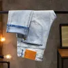 Mäns jeans designer högkvalitativ ljusfärg texturerad ståletikett tvättade vatten jeans mångsidiga elastiska smala passformar små raka benbyxor m61g