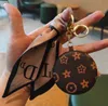 6Style Créativité Cosmetic Mirror Keychain Coin Purse Pending Charm Bijoux de cavalier Fashion Pu Leather Flower Grid Designer Metal Key Chain