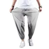 Pantaloni maschili sportivi uomini in seta ghiacciata tasche a fascia alla caviglia sciolte pantaloni elastici palestra in vita elastica travando jogging lunghi pantaloni della tuta lunghi