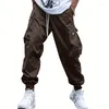 Calças masculinas Hip Hop Mens Cargo 2024 Primavera Moda Moda Moda de cor sólida Tie-up Bolsões Págôs Troushers Sports Fitness Men