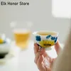 2pc/set a la luz de la luna esmalte amarillo cerámica taza de té puro pintado a mano de girasol master copa pétal pétal kung fu juego de té 40 ml