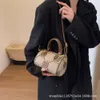 Jesienna i zimowa nowa litera Jacquard Single Rame Crossbody Wysokiej klasy Wykwintny torebka Trenda Śliczna torba na poduszkę 78% zniżki na sklep hurtowy