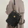 Chaîne xiaoxiangfeng sac à dos texturé de banlieue voyage petit sac à école en cuir authentique