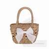 Children hollow paper rope weaving handbags girls Bows applique hand bags kids beach holiday vegetable basket Z7637