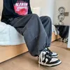 Jeans de jeans masculino Men japonês Bloomers Larra larga calças de perna larga moda de rua alta Lavagem Lava as roupas de tração solta lada L49