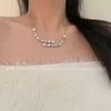 une chaîne de clavicule sophistiquée et luxueuse.Collier de perle étoilé à cinq étoiles asymétriques pour femmes