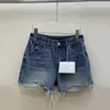 Shorts Shorts Fashion Denim Tasella Design a buco spezzato Design in alto in vita American Streetwear Wrap Hip Short Jeans Summer 2024 Ax64