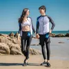 Casais Rash Guard Manga Longa Menwarwear Front Zipper Mulheres brancas pretas estampas de retalhos de retalhos de retalhos de vestes de merda de roupa de banho 2023