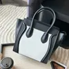 2024 Luxus -Einkaufstasche Klassische Handtasche Einkaufstasche Designer Taschen Echtes Leder Lächeln Gesicht Tasche Trapez Cross Lod Bag zwei Größe für Ihre Option