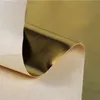 Film métallique de couleur dorée PU Tissu en cuir synthétique Vêtements de semelles en gros tissu en gros par le mètre pour coudre un matériau de bricolage