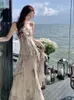 Robes décontractées Femme Ink Imprimé en mousseline de mousseline Midi Vintage Sans manches minces Summer Boho Backless Holiday Beach Vestidos Robe