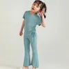 Zomermeisje Kledingpak Roundneck Roundneck Korte mouw Blouse Flousflared broek eenvoudig ontworpen mode casual uitje sets voor kinderen outfit 240408