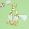 Клавные моды Bling English Letter Perting Permoniated Originality Green Pendent For Women Bag Car Keyring с белым хрусталем кисточки