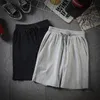 Nieuwe modemannen zomer losse halve lengte korte solide kleur zakken comfort casual broek sportstrand korte broek katoen midden in de taille broek stevige kleuren broek