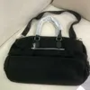 El diseñador de bolsos vende bolsas para mujeres de marca con descuento para una nueva bolsa de viaje de nylon de nylon de gran capacidad.