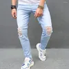 Jeans maschi maschi che allungano buchi magri pantaloni da maschio eleganti.