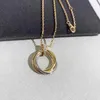 Designer Charm Carter Classic Three Color Ring ketting met glanzend oppervlak en in elkaar grijpende kraagketen Circulaire hanger voor vrouwen