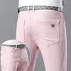 Pantaloni da uomo jeans jeans pantaloni di moda elastica slitta dritta coreana casual giallo rosa dei giovani