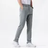 Pantaloni maschili primaverili ed estate 2024 prodotti leggeri affari fitness comodo show a tutto tondo sottile thag-gambe tide