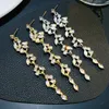 Bengelen oorbellen high-end licht luxe ingelegde zirkon klein blad kwastje lange ronde gezicht blootgesteld voor vrouwen