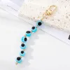 Boho Rainbow Blue Evil Eye Beads Keychain Keychain Key Anneau pour les amants d'amis Round Turkish Lucky Eye Bag Car AirPods Box Clé Accessoires