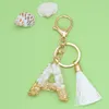 Клавные моды Bling English Letter Perting Permoniated Originality Green Pendent For Women Bag Car Keyring с белым хрусталем кисточки