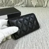 Designer de marca Bolsa Mulheres/homens Crédito Titular do cartão de Cordeiro Saco de moedas de bolsa de couro de campina/caviar Pacote de moeda Bolsa de moeda com caixa da caixa X31 Cartilhas de bolsa de bolsa Carteira de dinheiro 11cm