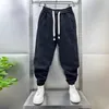 Calça masculina masculina calça casual harém com empate elástico com cintura elástica Bolso de zíper profundo