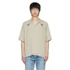 T-shirts masculins aiguilles de la chemise denim en denim Single de boutons poches conception mens pour femmes broderie à manches courtes à manches courtes T-shirt J240409