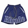 Rhude Men Breatchable Beach Shorts Men Femmes Casual Mesh Track Brewable Oversize Shorts Riscus de la taille de la taille