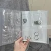 Caixas de armazenamento PVC Bolsas transparentes Brios selados de colar de anel Jóias Anti-oxidação INS Dust Livro