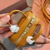 Mode koehide lederen cosmetische tas designer tas luxe merk handtas casual arcadie handtas klassieke cameratas schattig echt lederen mini messenger tas 2 kleuren