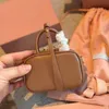 Mode koehide lederen cosmetische tas designer tas luxe merk handtas casual arcadie handtas klassieke cameratas schattig echt lederen mini messenger tas 2 kleuren