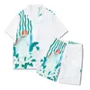 Mens Tracksuit Designer Men Luxury Short and T Shirt Summer Versatile Trend Sports Button Cardigan Top Lapel kortärmad shorts Seaside Beach Style Fake Two-Piece