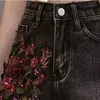 Цветочные вышитые секс -джинсы Женщина ужина короткие бисеропинки черные джинсовые брюки женская кисточка танцевать горячие брюки мода