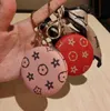 6Style Créativité Cosmetic Mirror Keychain Coin Purse Pending Charm Bijoux de cavalier Fashion Pu Leather Flower Grid Designer Metal Key Chain