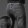 Heren jeans designer jeans voor herenlicht luxe Koreaanse editie dikke elastische voeten slanke jeugdblauwe en zwarte broek mu6f