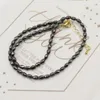 Hänge halsband mode svart hematit halsband fasetterade risformade pärlor smycken reiki helande gåva unisex charms naturlig energisten