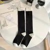 Femmes chaussettes thermiques noires blanches longues étages floraux lolita filles kawaii knoue mignon jk coton de style japonais