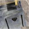 Kvinnors jeans högkvalitativa herrdesigner byxor män smal liten rak bomull casual denim byxor modea triangel logotyp brev gra dhsdb