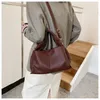 Bolsas de cintura nicho francês Khaki Bag Bucket Spring/verão 2024 Bolsa de moda versátil Ins simples Ha simples feminina
