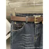 Grundläggande avslappnade klänningar Höst/vinternischdesign Brevbälte Utsmyckning Enkel och fashionabla jeans